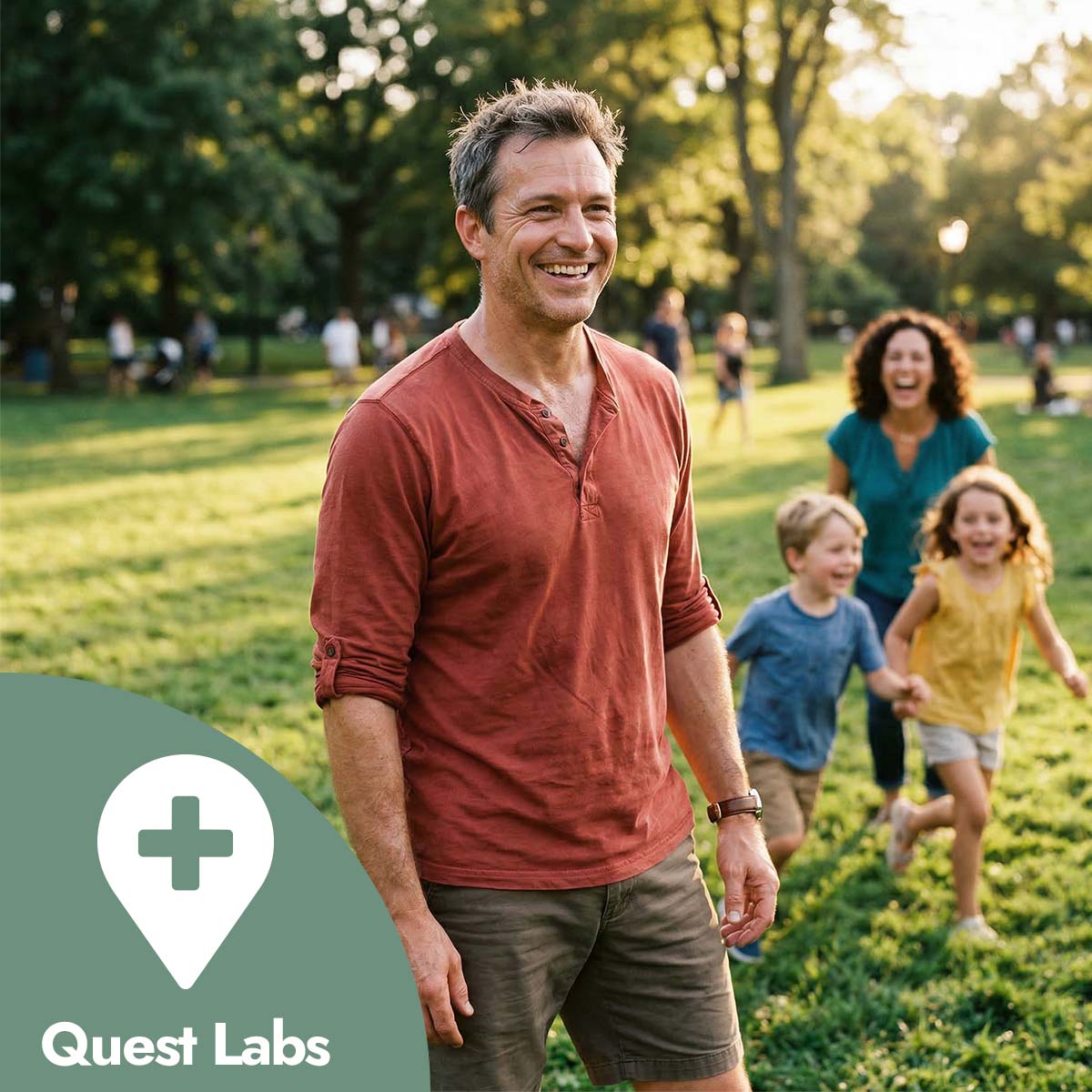 Man standing in a park with children running behind him, with Quest Labs logo in the corner.