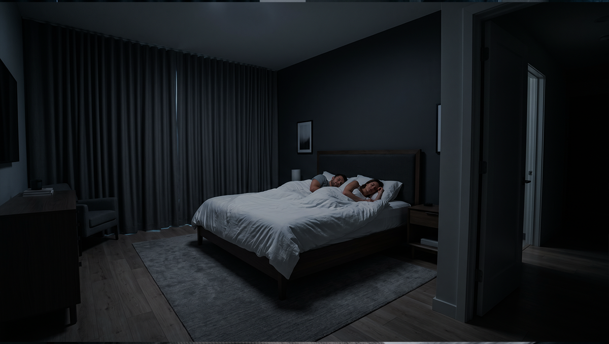 Dark bedroom with a bed and nightstands.