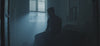 Man sitting in the dark depressed, sad, unable to sleep.